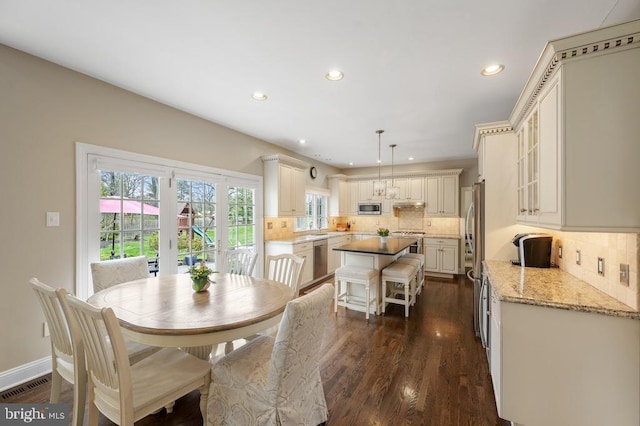 dining room with recessed lighting, baseboards, visible vents, and dark wood-type flooring