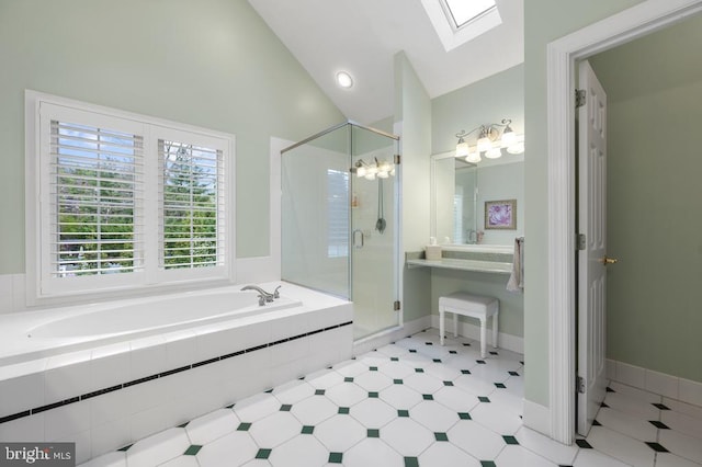 full bathroom with a garden tub, lofted ceiling with skylight, a notable chandelier, and a shower stall