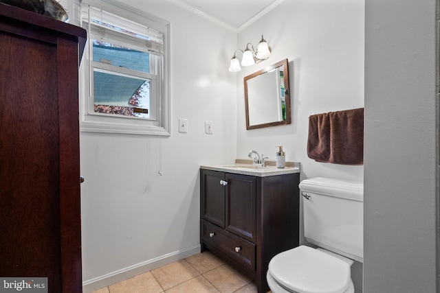 bathroom with tile patterned floors, baseboards, vanity, toilet, and ornamental molding