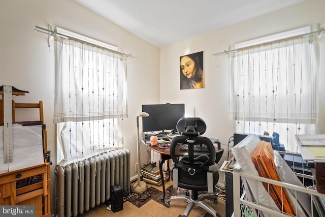 home office featuring plenty of natural light and radiator heating unit