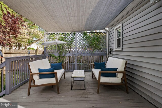 deck with fence and outdoor lounge area