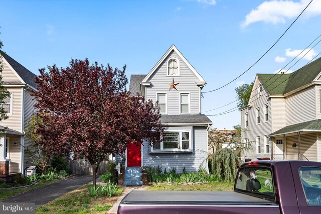 view of front of home with a shingled roof
