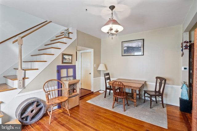 dining area featuring stairway and hardwood / wood-style floors