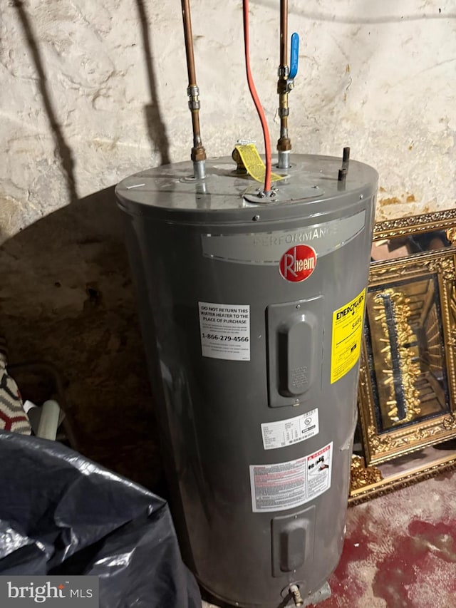 utility room featuring electric water heater