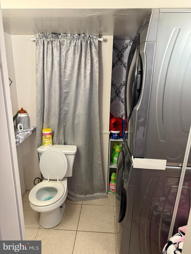 bathroom with toilet and tile patterned floors