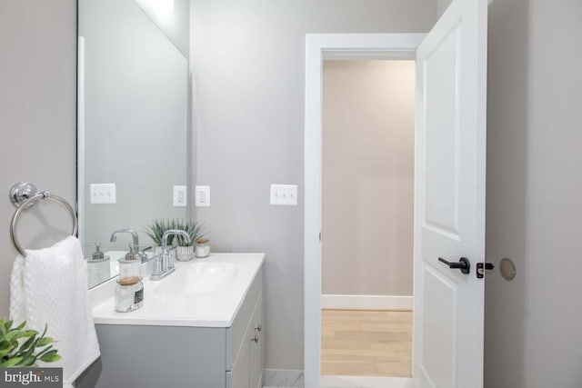 505 Kennedy St NW Unit 302, Washington, DC 20011 - bathroom featuring baseboards, wood finished floors, and vanity