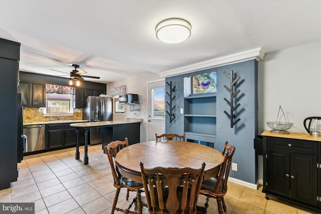 dining room featuring a ceiling fan and light tile patterned floors