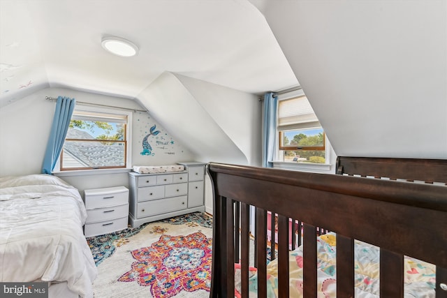 bedroom featuring lofted ceiling