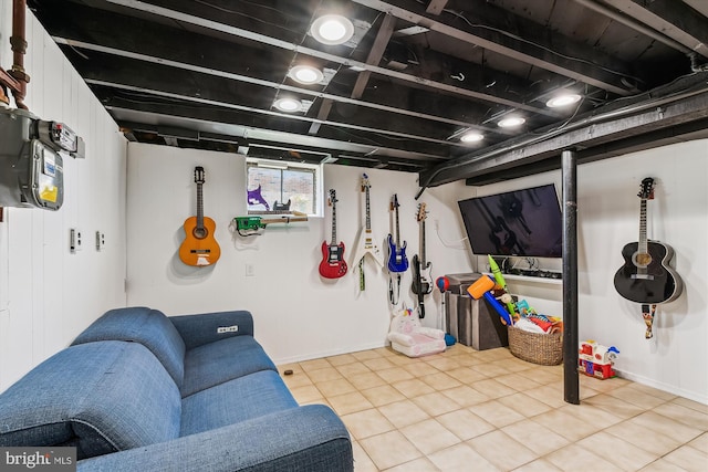 interior space featuring tile patterned floors and baseboards
