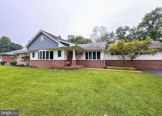 5620 Trotter Rd, Clarksville, MD 21029 - view of front of home featuring brick siding and a front yard