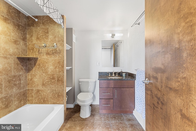 full bath with toilet, vanity, tile patterned flooring, tub / shower combination, and baseboards