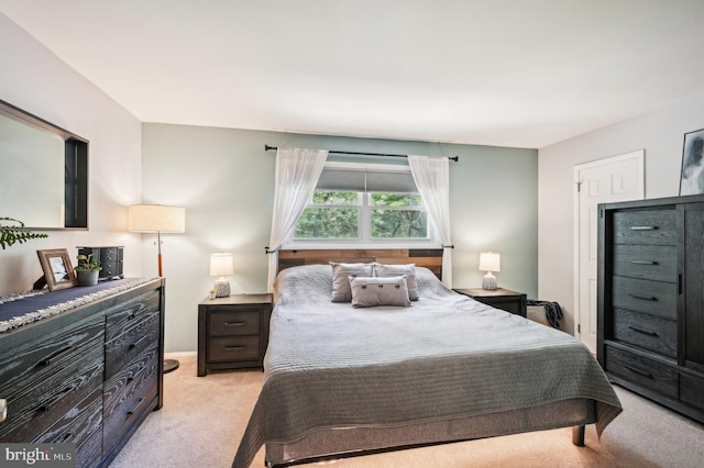 bedroom with light colored carpet