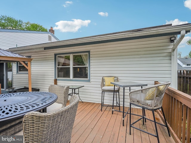 deck with outdoor dining space