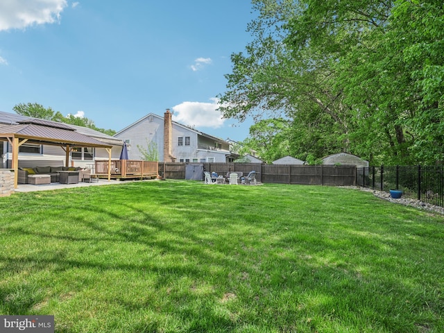 view of yard featuring an outdoor living space, a gazebo, and a deck