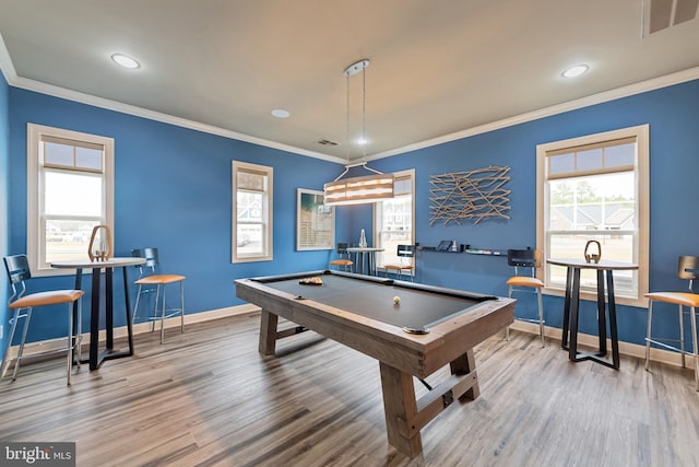 game room featuring pool table, baseboards, wood finished floors, visible vents, and ornamental molding