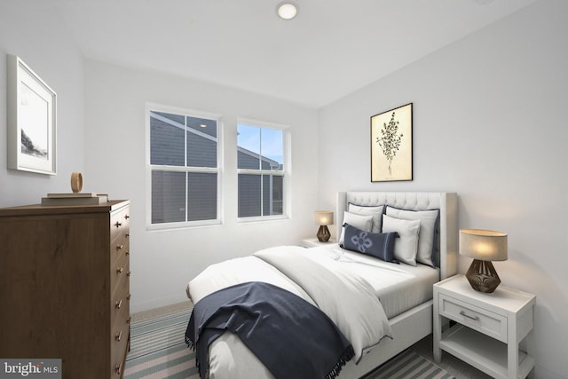 bedroom with carpet floors and baseboards
