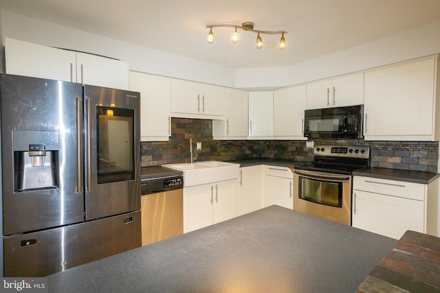 229 Keats Ct, Sicklerville, NJ 08081 - kitchen with appliances with stainless steel finishes, dark countertops, white cabinets, and tasteful backsplash