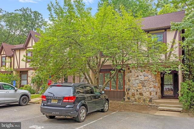 229 Keats Ct, Sicklerville, NJ 08081 - view of front of property with stone siding, uncovered parking, a shingled roof, and stucco siding
