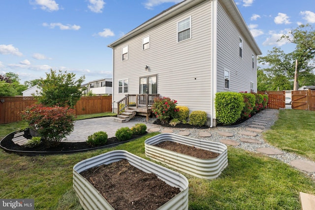 1600 Ballinger Ave, Landover, MD 20785 - rear view of house featuring a gate, a patio, a garden, and french doors