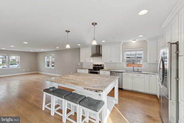 1600 Ballinger Ave, Landover, MD 20785 - kitchen with stainless steel appliances, a sink, wall chimney exhaust hood, recessed lighting, and white cabinetry