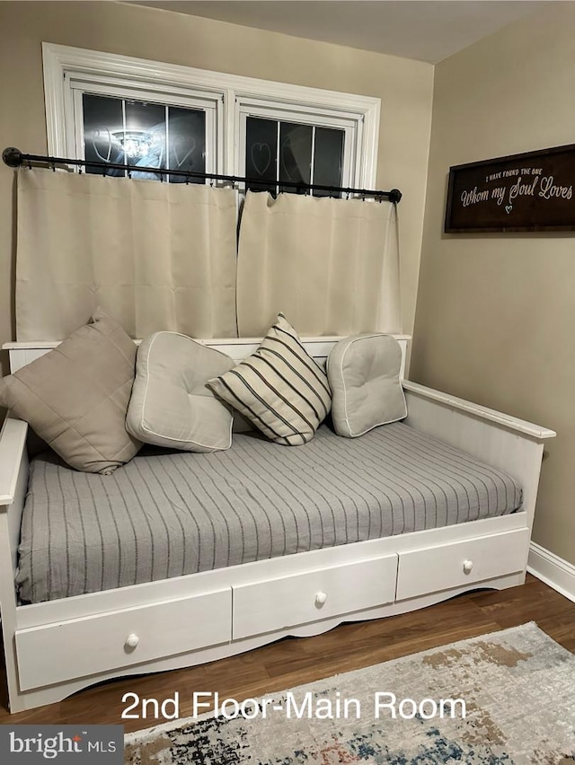 mudroom with baseboards and wood finished floors