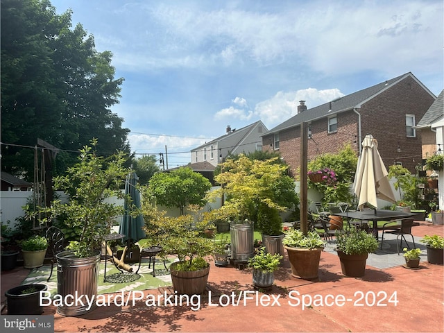 surrounding community with a patio and fence