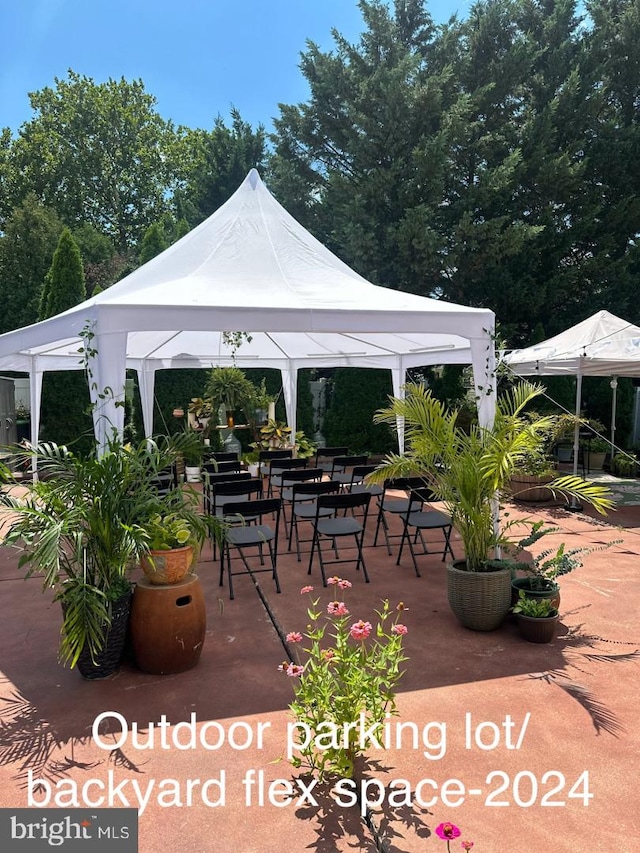 view of patio / terrace with a gazebo and outdoor dining space