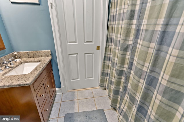 full bathroom with vanity, tile patterned flooring, baseboards, and a shower with curtain