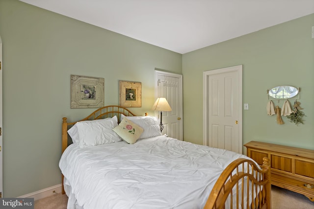 carpeted bedroom featuring baseboards