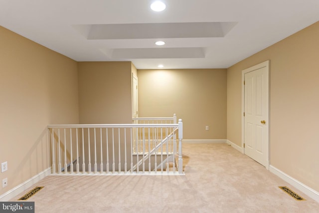 empty room featuring recessed lighting, baseboards, visible vents, and carpet