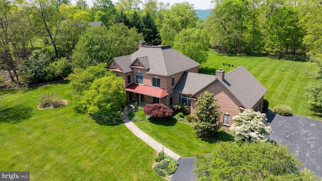 drone / aerial view with a view of trees