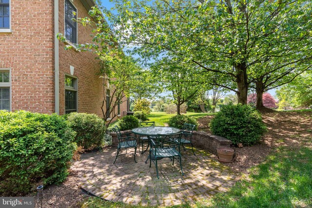 view of patio with outdoor dining area