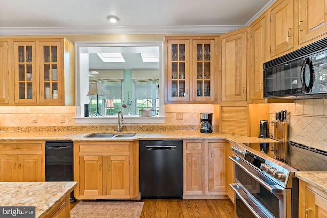 kitchen featuring backsplash, double oven range, black microwave, a sink, and dishwashing machine