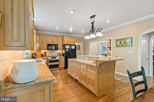 kitchen featuring crown molding, light brown cabinetry, arched walkways, a sink, and black appliances
