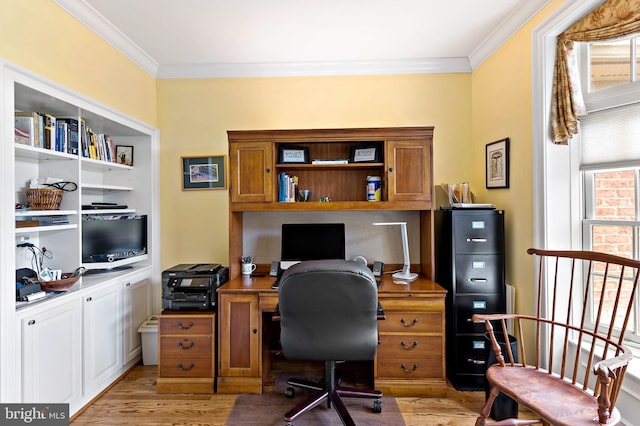 office space with ornamental molding and light wood-style flooring
