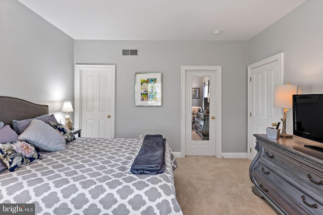 bedroom with light colored carpet, baseboards, and visible vents