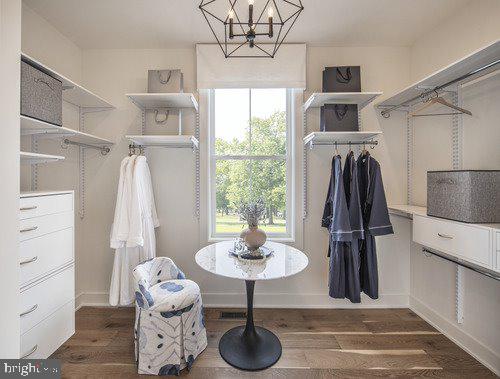 1 Mill Creek Dr Lot 1, Doylestown, PA 18901 - spacious closet featuring a notable chandelier and wood finished floors