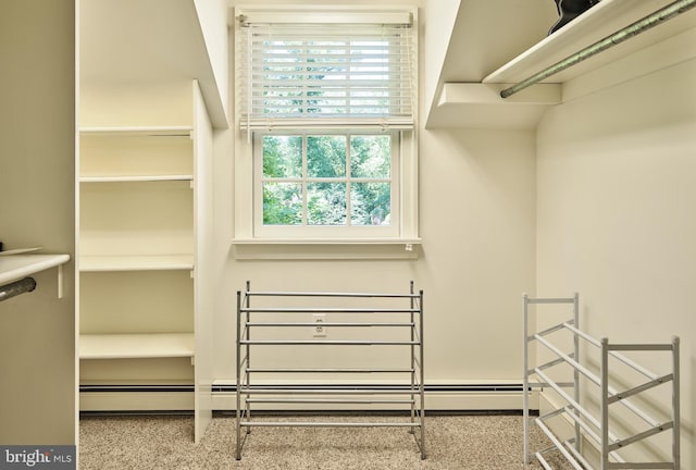 spacious closet with a baseboard radiator