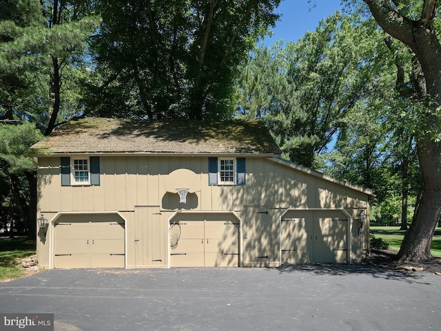 view of front of property with a detached garage