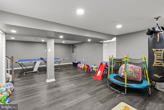 recreation room with recessed lighting, baseboards, and wood finished floors