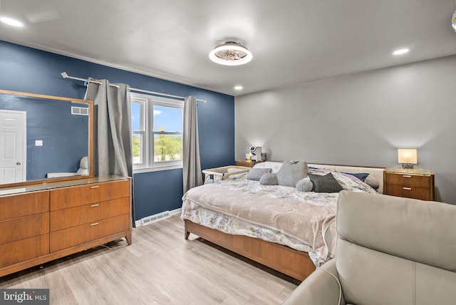 bedroom featuring visible vents, recessed lighting, baseboards, and wood finished floors