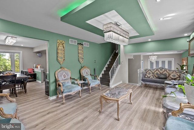 living room with baseboards, recessed lighting, wood finished floors, and visible vents