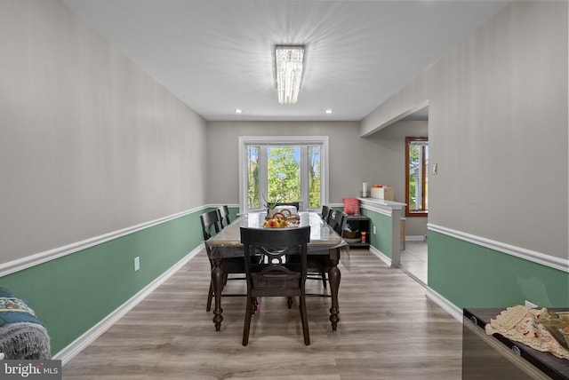 dining room with baseboards, recessed lighting, and wood finished floors
