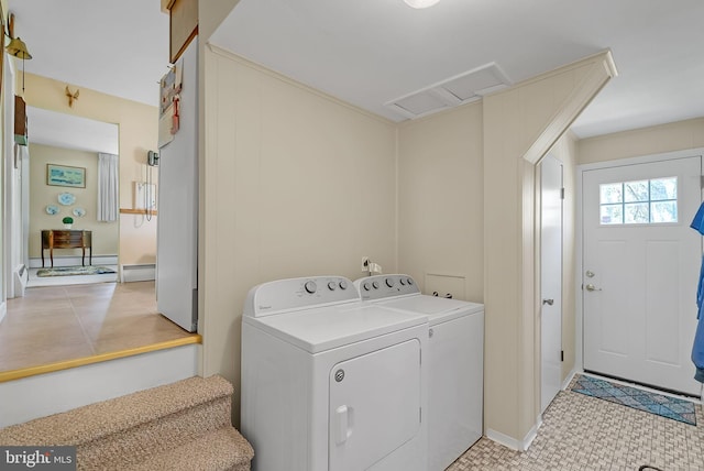 clothes washing area with attic access and independent washer and dryer