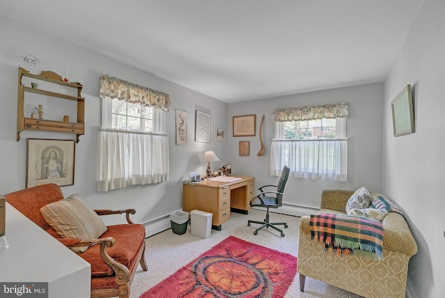 living area featuring carpet floors, baseboards, a baseboard heating unit, and a wealth of natural light
