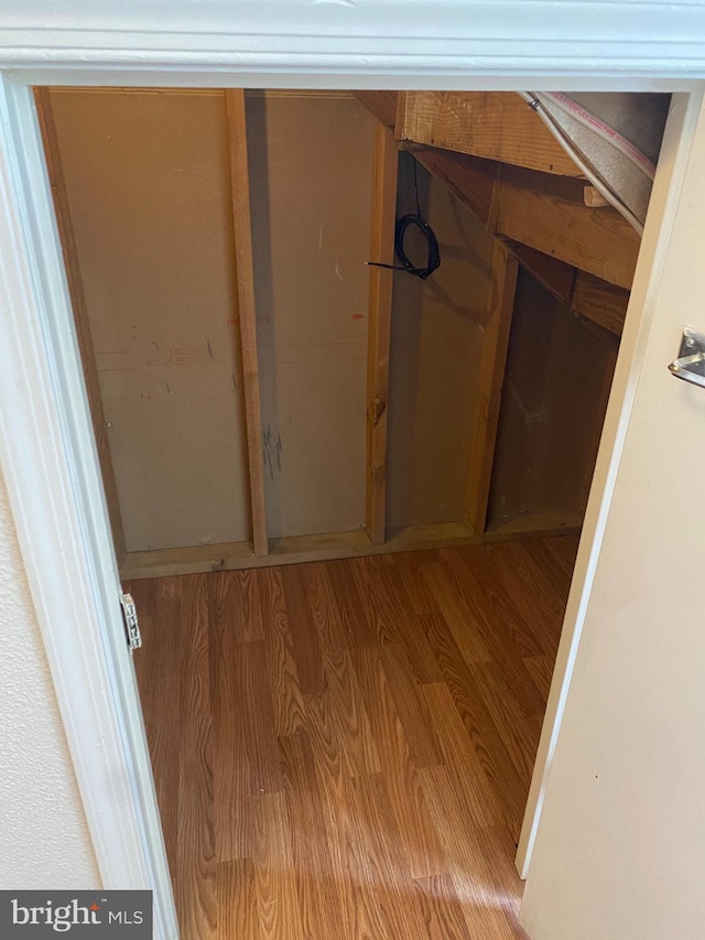 corridor featuring wood finished floors