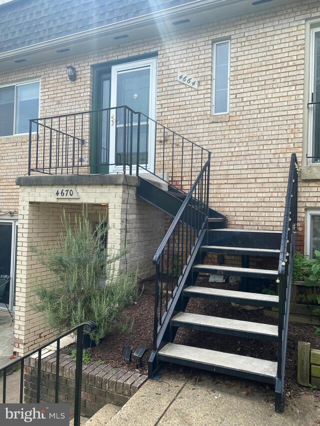 property entrance with brick siding