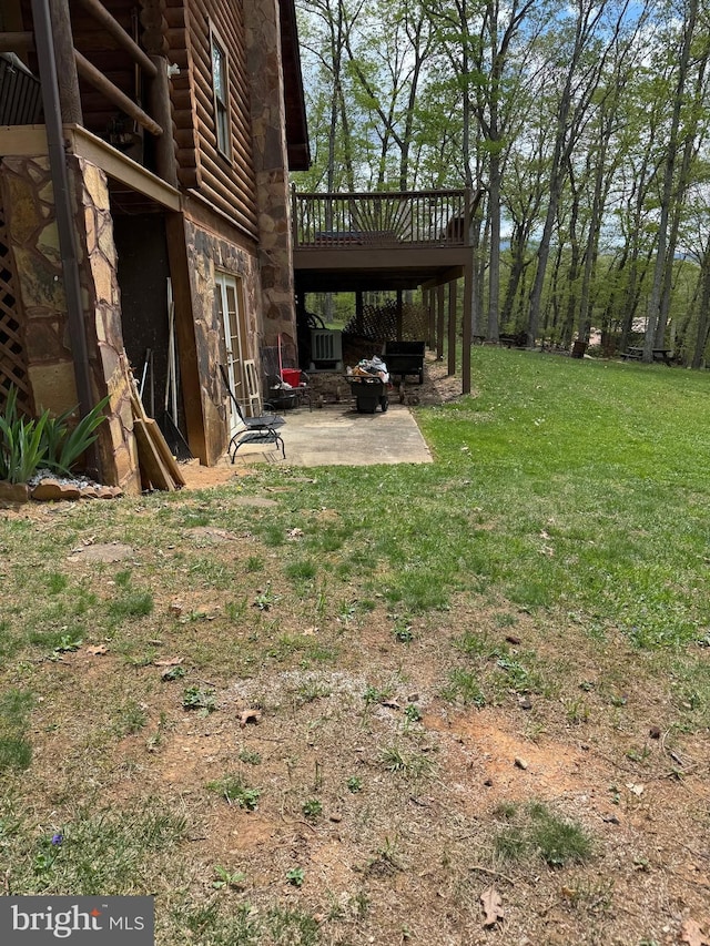view of yard with a patio area and a deck