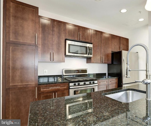 444 W Broad St Unit 407, Falls Church, VA 22046 - kitchen with appliances with stainless steel finishes, recessed lighting, a sink, and dark stone counters