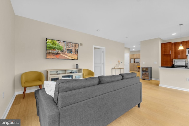 444 W Broad St Unit 407, Falls Church, VA 22046 - living room with light wood-style floors, baseboards, wine cooler, and recessed lighting